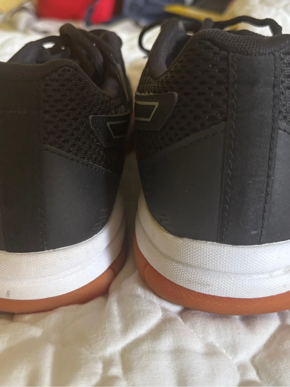 Asics Black Athletic Shoes with Orange Outsoles